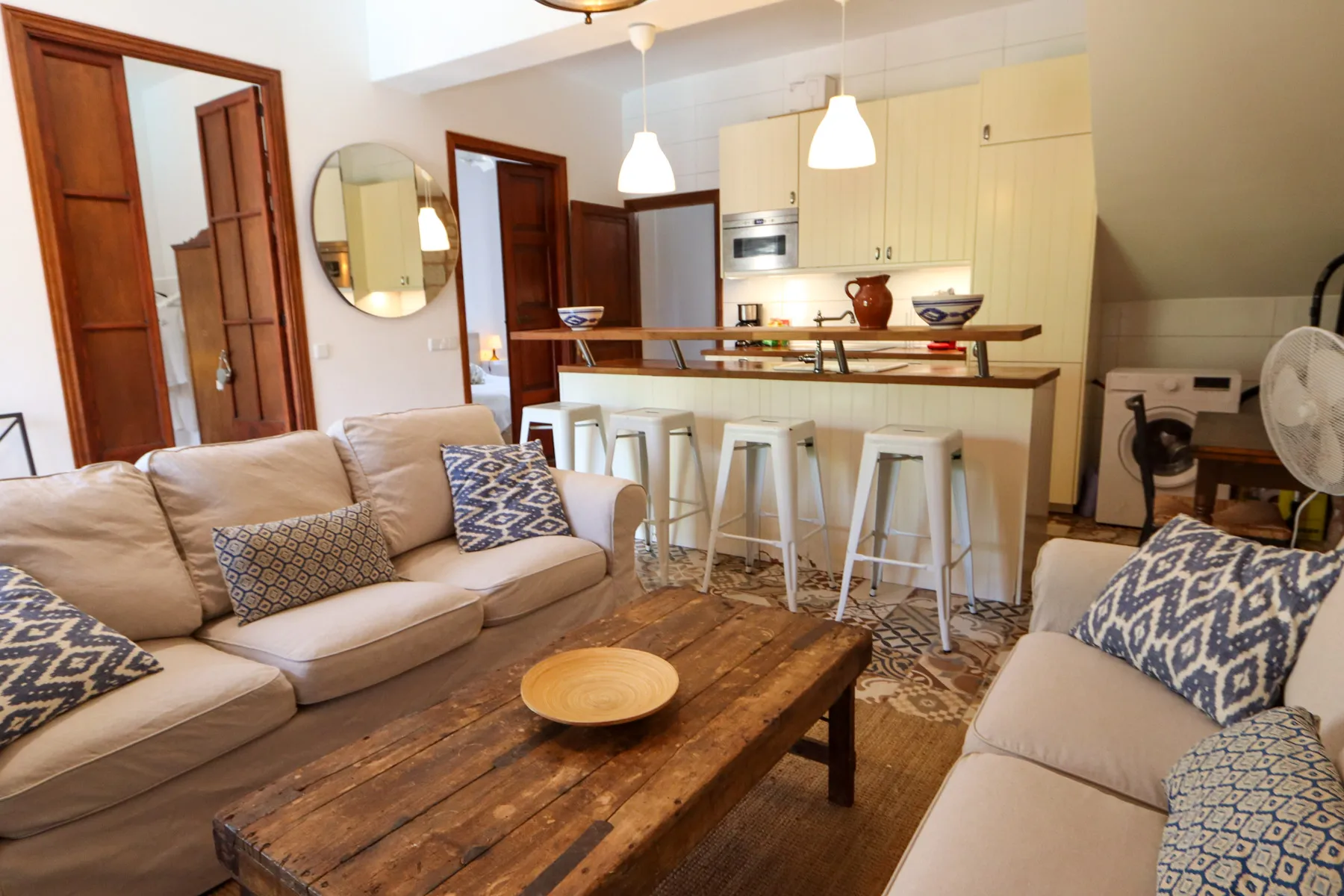 The apartment is situated on the ground floor and features a cozy living and dining area with an open-plan kitchen, two bedrooms, and one bathroom. A spacious private terrace invites you to relax and provides direct access to the garden and the communal pool.